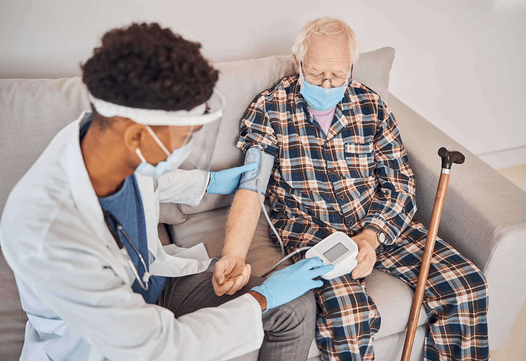 Medical professional using manometer on a patient