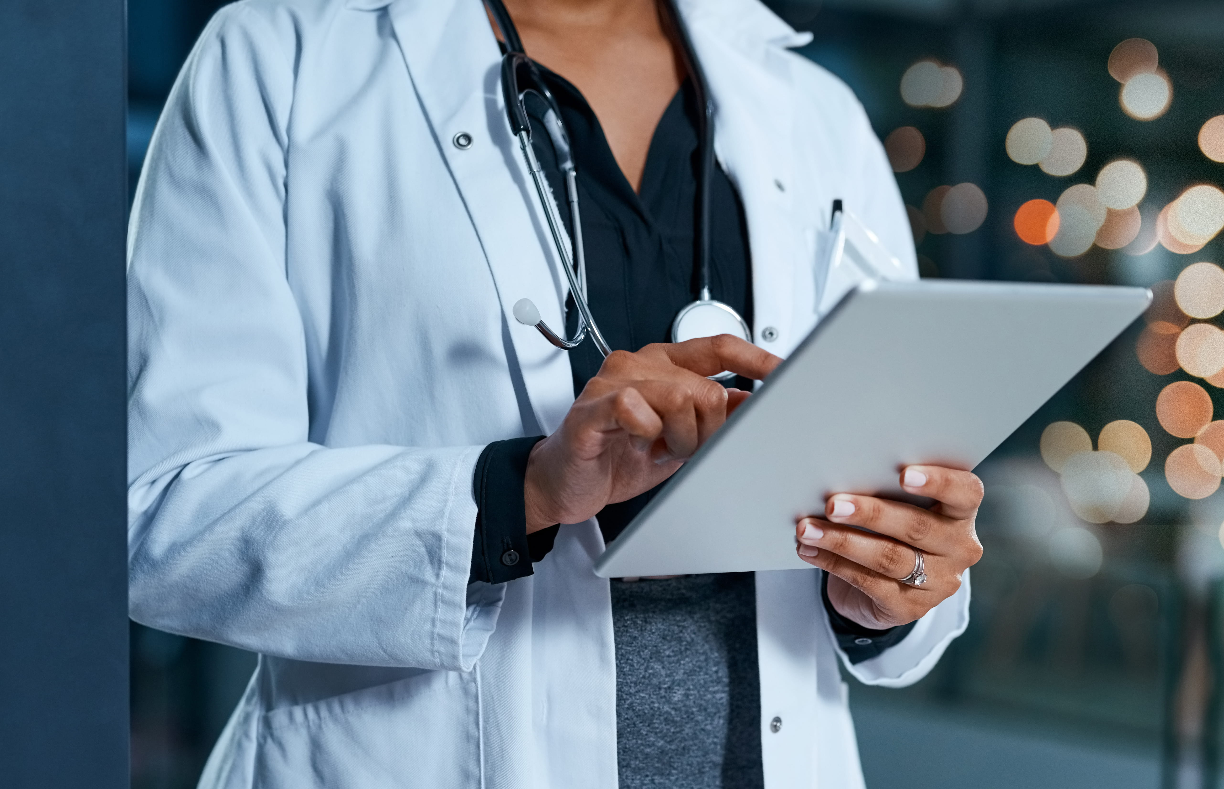 Doctor looking at iPad