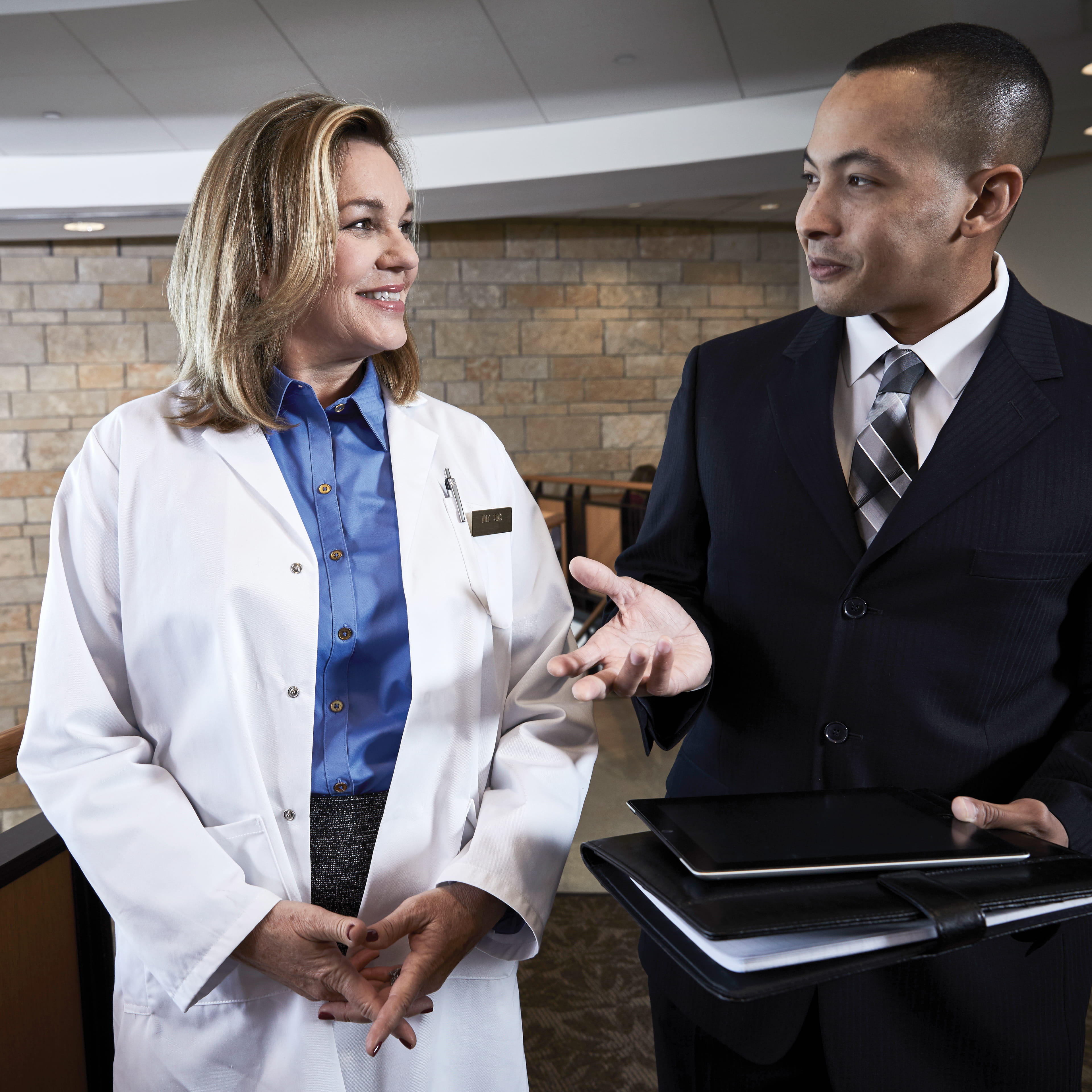 Medical professional meeting a business consultant